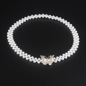 Elegant double-row pearl elastic waist belt with a sparkling rhinestone bow buckle for women