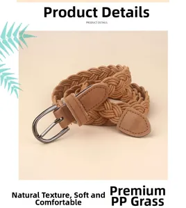 Detail of brown woven PP straw belt with metallic D-ring buckle and natural texture