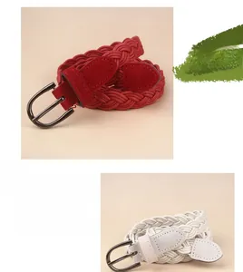 Detail of woven fabric belts with black metal pin buckle in burgundy and cream beige