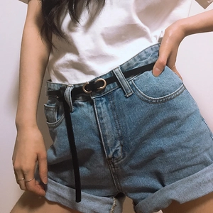 Slim black leather waist belt with gold double-ring buckle on white shirt and denim shorts