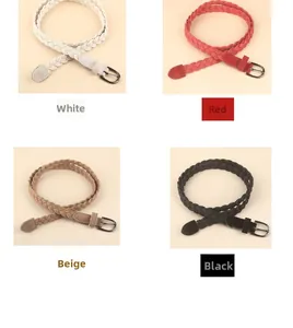 Detail of woven waist belts in white, red, beige, and black with round pin buckles
