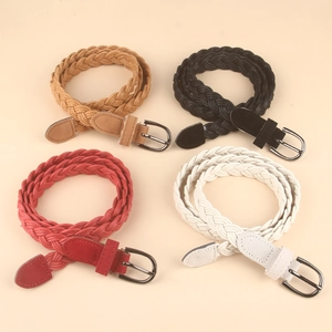 Detail view of woven waist belts in four colors with matte finish and metal D-ring buckles