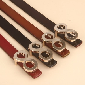 Detail view of slim leather belts for women with gold infinity buckle in four colors