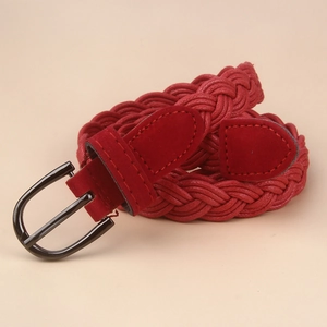 Close-up of red woven waist belt with metallic pin buckle and suede leather trim