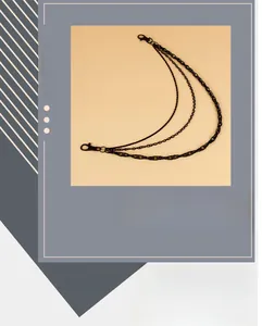 Detailed view of the multi-layered black metal trousers chain with lobster clasps