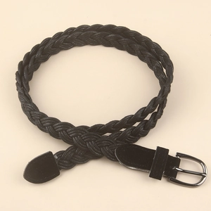 Detail of black woven belt featuring intricate texture and gunmetal D-ring buckle