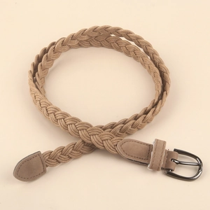 Close-up of woven khaki belt showing detailed texture and D-shape dark metal buckle