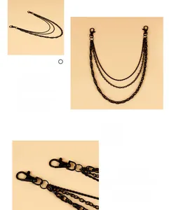 Detailed view of matte black multi-layer trouser chains with 360-degree swivel lobster clasps