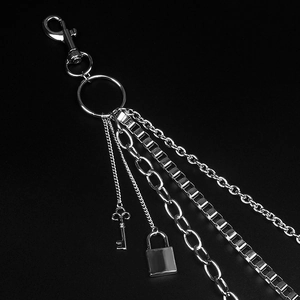 Three-layer silver hip hop waist chain featuring lock and key pendants on black background