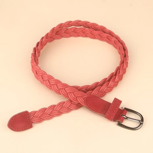 Detail of red woven leather belt featuring a vintage silver-tone D-ring metal buckle