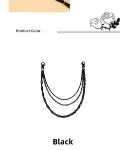 Detail view of multi-layer black metal pants chain with sturdy lobster clasps on white background