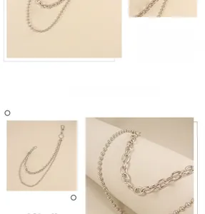 Detail of silver double-layer pant chain featuring bead and thick link designs