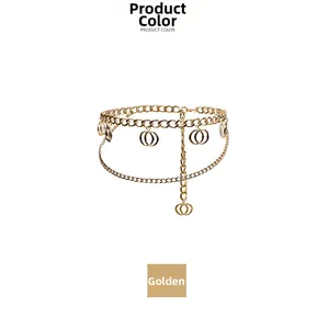 Detail of layered gold metal body chain featuring intertwined double ring pendants