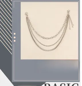 Close-up of triple-layered hip-hop waist chain with silver stars and punk fringe detail