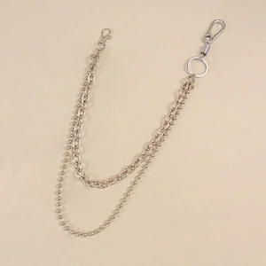 Detail of silver dual-layer trousers chain with flat links, beads, and lobster clasps