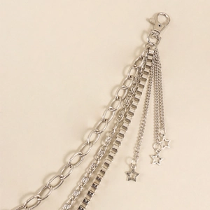 Detail of silver multi-layer metal hip-hop pants chain with hollow star charms and clasps