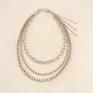 Detail of silver layered metal pants chain with star charms and lobster clasp