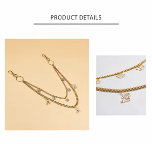 Detail of double-layer metal pant chain with hollow butterfly pendants and spring clasps