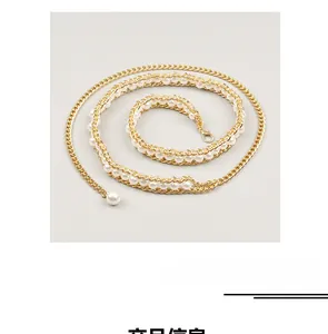 Detailed macro view of the multi-layered golden pearl waist chain with adjustable lobster clasp