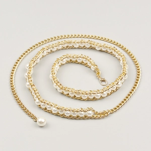 Detail view of gold metal waist chain with white pearls and adjustable lobster clasp