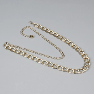 Golden twisted curb link chain waist belt with lobster clasp and teardrop pendant