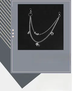 Detail of silver multilayer pant chain featuring mermaid and dolphin ocean pendants