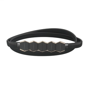 Detailed macro view of black elastic belt featuring a modern gold-trimmed geometric buckle