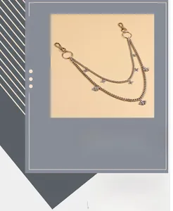 Detail of silver double-layered hip hop trouser chain with bee charms and clips