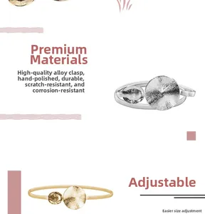 Detail of adjustable gold and silver metal bangles with polished solid alloy finish