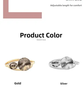 Detailed close-up of gold and silver metallic spring waist belts with double circular buckle