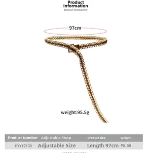 Detailed view of woven black PU leather and gold chunky chain belt with adjustable buckle