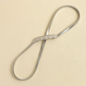 Close-up of silver elastic metal spring waist chain with geometric hexagonal buckle