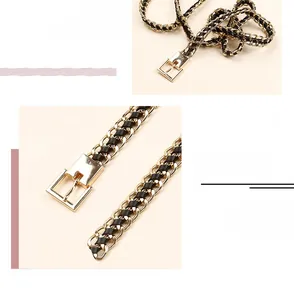 Detail of adjustable golden alloy chain belt with black PU leather weave and pin buckle