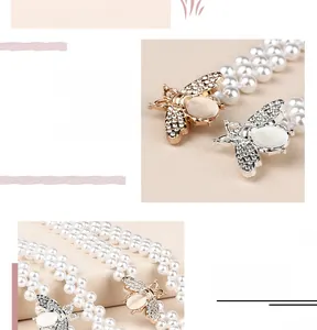 Détail d'une ceinture en perles avec boucle abeille dorée ornée de cristaux et œil-de-chat