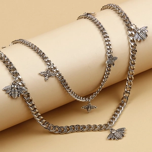 Silver curb chain pants chain with vintage bee charms for trendy streetwear and denim styling