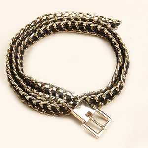 Exaggerated gold chain and black leather woven belt with a geometric rectangle buckle