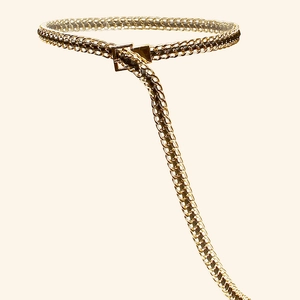 Close-up of golden metal chain woven with black PU leather featuring a square buckle