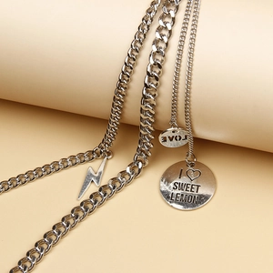 Multilayer silver chain accessory with lightning bolt and LOVE engraved pendants