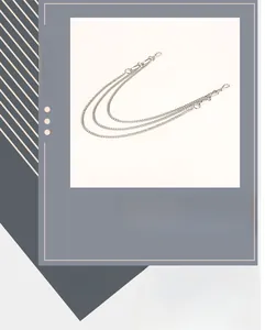 Detail view of a triple-layered silver metal hip-hop waist chain with lobster clasps