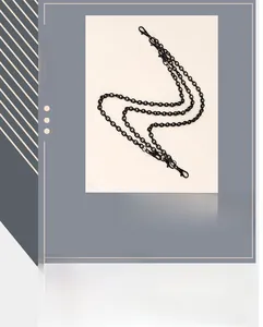 Close-up of multi-layered gun-black metal pant chain with lobster clasps for streetwear