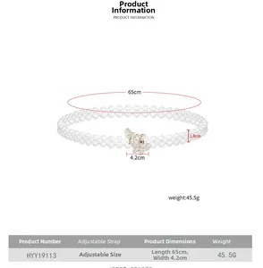 Dettaglio catena in vita di perle elastiche con fibbia a farfalla in strass e misure