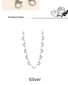Close-up of silver metal butterfly pant chain detail with durable lobster clasps