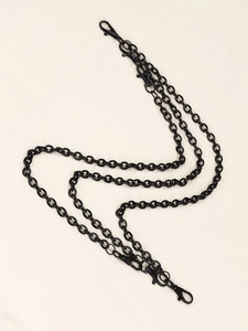 Detail view of multi-layered gunmetal black punk trousers chain with four lobster clasps