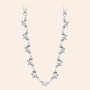 Detail of silver metal butterfly chain with lobster clasps for pants and accessories