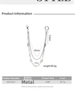 Detail of silver punk hip-hop trousers chain with flame metal pendant and lobster clasp