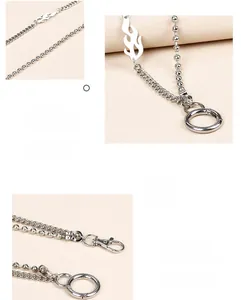Detail of silver flame charm pant chain featuring rotating lobster clasp and electroplating