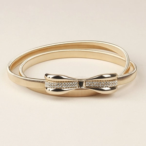 Ceinture élastique dorée en métal avec boucle de nœud sertie de strass brillants pour femmes