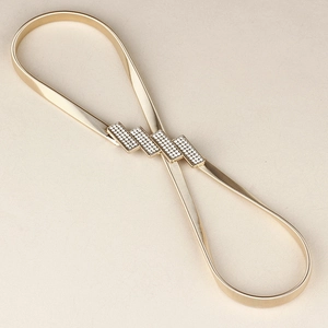 Elegant gold elastic metal waist belt for women featuring a sparkling rhinestone buckle