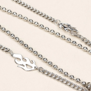 Silver metal flame charm belt chain with ball and curb links for punk streetwear style