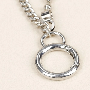 Detail of silver metal pant chain with O-ring clasp and industrial link texture